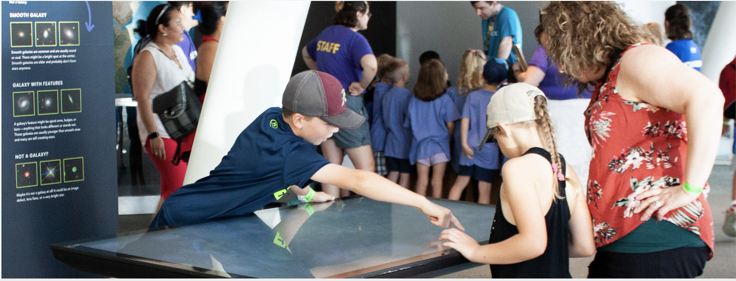 Visitors interacting with U!Scientist. Credit: Obiorah et al., 2021